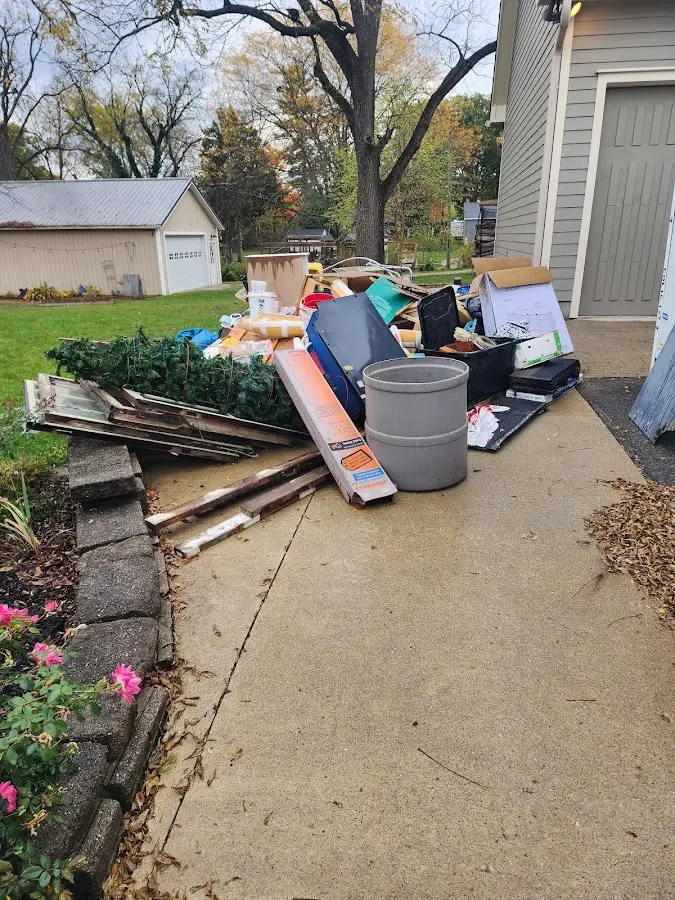 Dumpster being loaded with debris for Commercial Dumpster Rental in American Fork